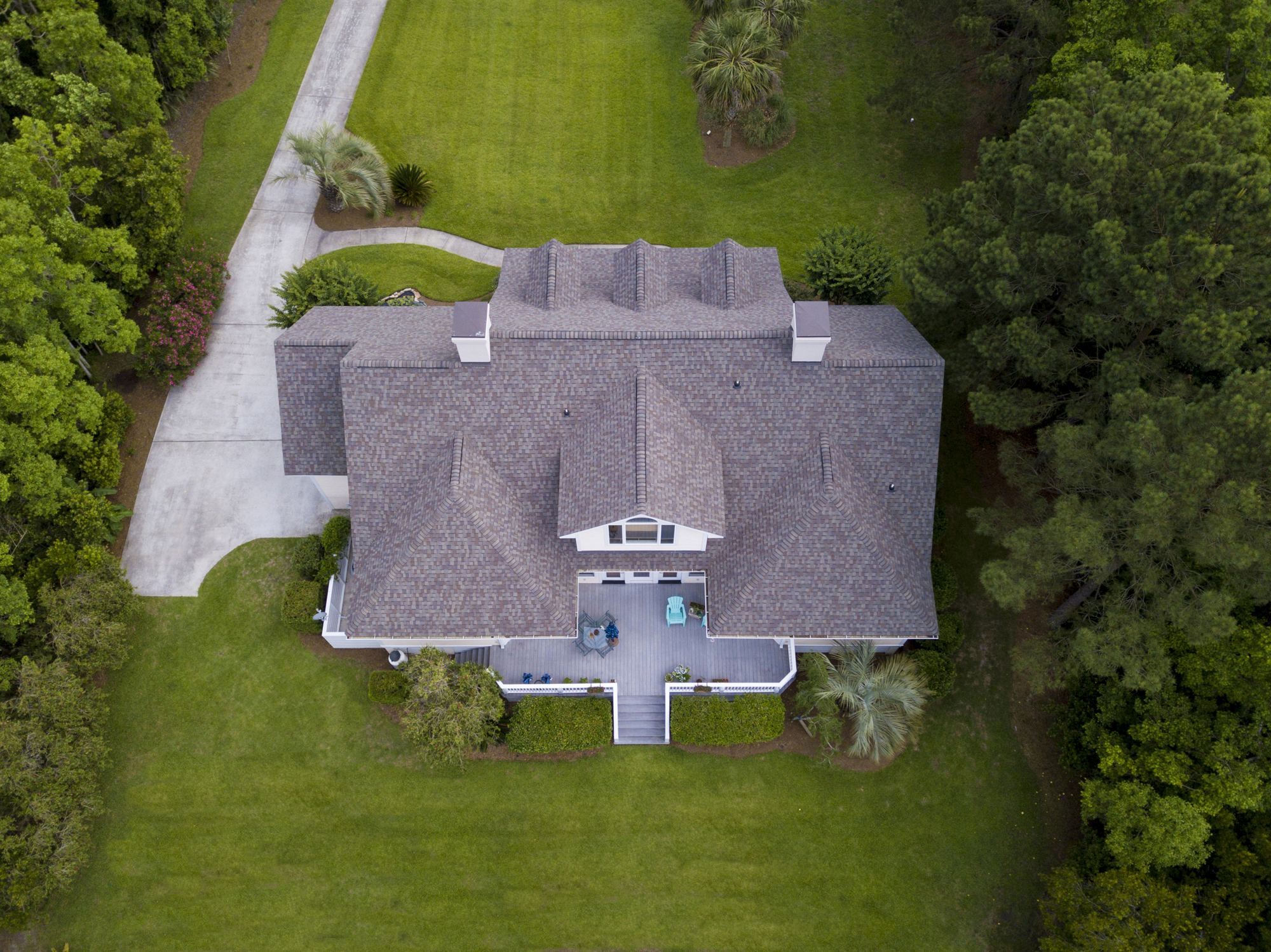 Aerial view of a home with a shingle roof